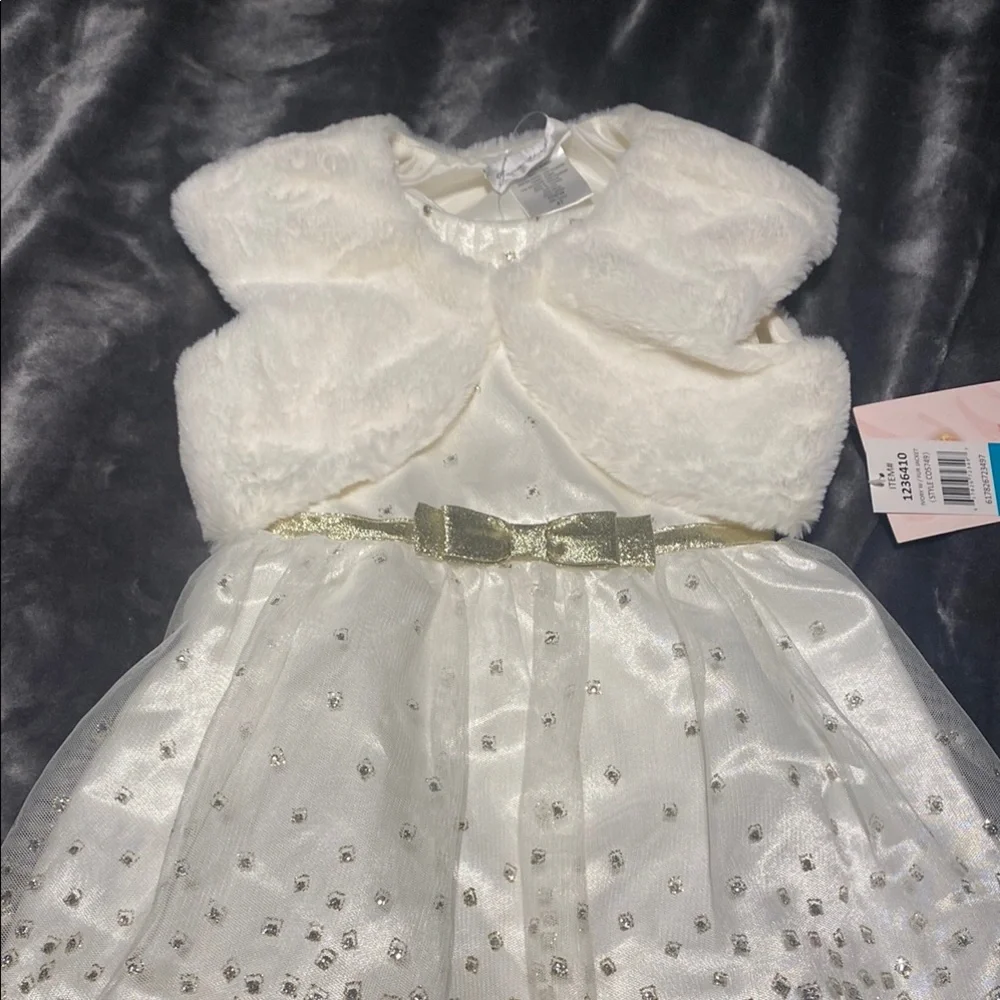 Jona Michelle, Elegant Ivory dress with Gold Bow.
